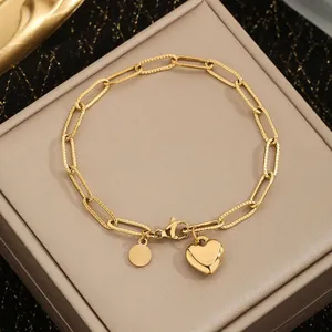 Elegant gold stainless steel paperclip chain bracelet with a heart pendant charm
