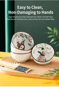Détail de bols en céramique avec illustrations d'animaux mignons et des baguettes