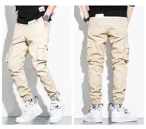 Detailed view of men's khaki cargo joggers with multi-pockets and elastic cuffs for casual wear