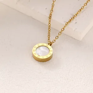 Close-up detail of a gold titanium steel necklace with a circular Roman numeral pendant