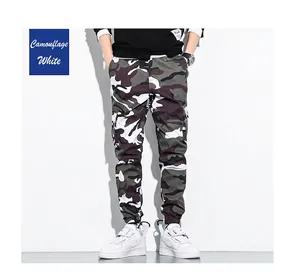 Detailed view of men's white camouflage cargo pants featuring a multi-pocket street style