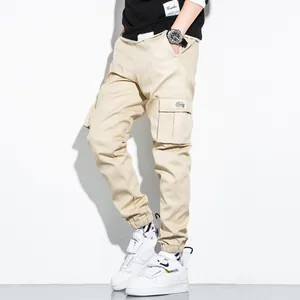 Men's beige pure cotton cargo jogger pants featuring multi-pocket design and elastic cuffs