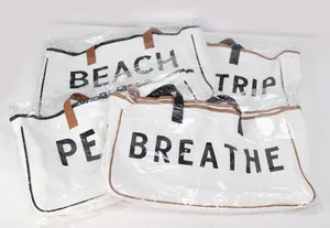 Multiple large capacity canvas tote bags with English text prints in plastic packaging