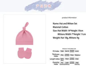 Soft cotton pink baby knot beanie and scratch mittens set for newborns and infants.
