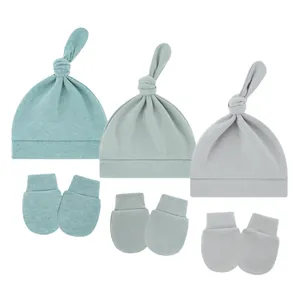 Detail of 3-pack baby knotted hats and anti-scratch mittens in soft muted tones