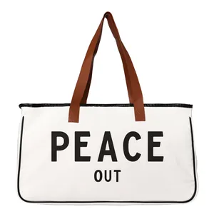 Spacious white canvas beach tote bag with Peace Out slogan print and brown handles