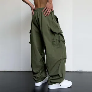 Back view of men's olive green quick-dry parachute cargo pants with multiple utility pockets