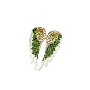 Elegant angel wings brooch with green enamel and sparkling rhinestones for women