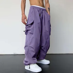 Detailed view of stylish purple nylon quick-dry parachute cargo pants with wide-leg design