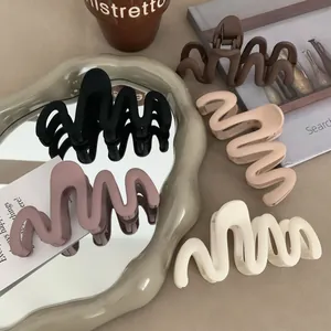 Stylish matte wavy hair claw clips in neutral solid colors for thick hair accessories