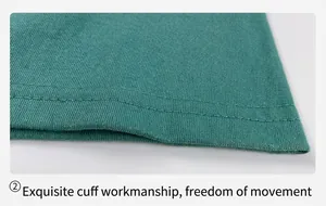 Detailed view of exquisite double-stitched sleeve cuff on teal cotton T-shirt.