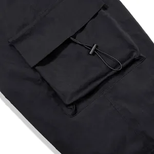 Detail view of nylon quick-dry cargo pants featuring a pocket with adjustable drawstring toggle.