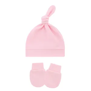 Soft pink cotton baby knot hat and anti-scratch mittens set for newborns and infants