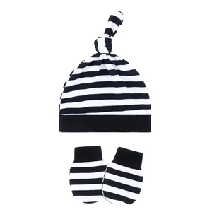 Black and white striped infant beanie and matching anti-scratch mittens set