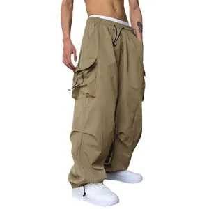 High-waisted khaki men's quick-dry cargo parachute pants with wide-leg and drawstring waist