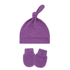 Soft purple baby top knot hat and matching anti-scratch mittens set for newborns