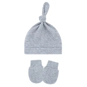 Grey cotton baby knot hat and matching anti-scratch mittens set for newborns and infants