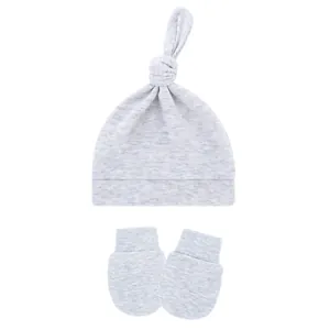 Detail view of a soft grey knotted baby hat and matching scratch-proof mittens set
