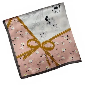 Detail of pink and white silk square scarf with floral rose and bow design