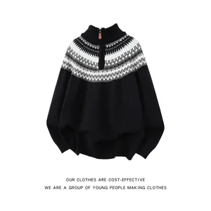 Close-up of the Fair Isle ethnic pattern on this black half-zip knit sweater for winter
