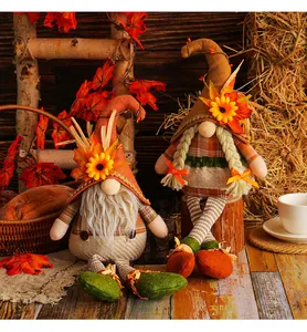 Detailed view of Thanksgiving harvest gnomes with sunflower and maple leaf decorations
