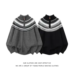 Detail view of grey and black Fair Isle jacquard knit sweaters with half-zip collars