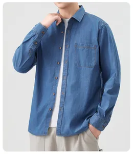 Detailed macro view of a men's classic blue denim shirt with pocket and buttons