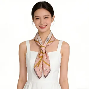 Elegant pink mulberry silk square scarf with delicate floral pattern worn on neck