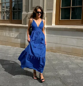 Elegant blue V-neck cotton linen maxi dress with spaghetti straps and ruffled hem