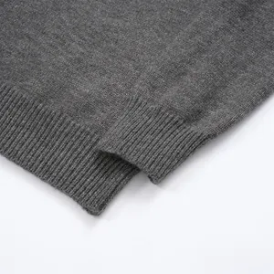 Detailed macro shot of gray knit sweater ribbed hem and soft fabric texture