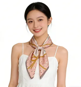 Elegant pink floral silk square scarf tied around neck of a woman on white background