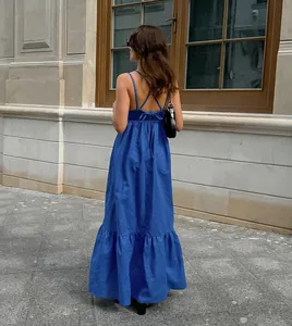 Rear view of blue cotton linen maxi dress with cross-back straps and bow detail