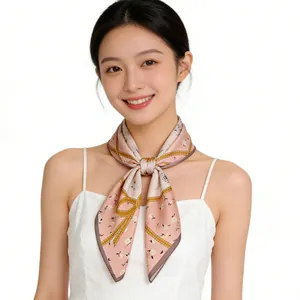 Elegant Asian model wearing a pink floral mulberry silk square scarf on white background