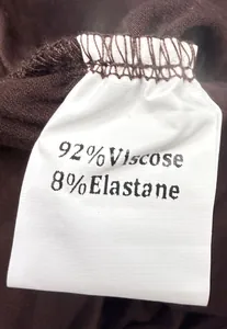 Macro view of garment care label showing 92% Viscose and 8% Elastane fabric content