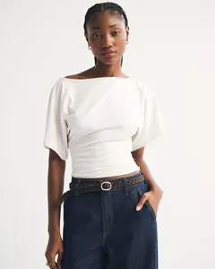 Close-up of stylish white boat neck t-shirt with elegant ruched waist detail