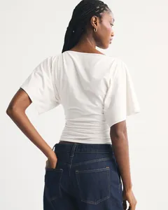 Stylish white batwing sleeve cropped t-shirt for women with ruched waist detail