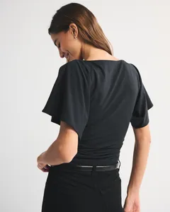 Professional back view of women's black batwing sleeve t-shirt with ruched waist