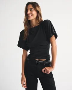 Stylish detail of black batwing sleeve T-shirt featuring a chic ruched waist design