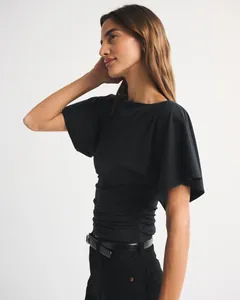 Chic black short sleeve top featuring elegant batwing sleeves and a flattering ruched waist.
