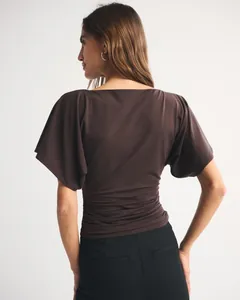 Detailed back view showing the ruched waist and batwing sleeves of this brown t-shirt.