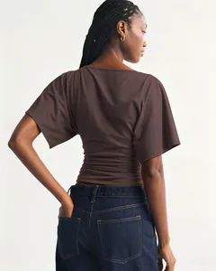 Detailed back view of a brown short sleeve batwing t-shirt featuring ruched waist