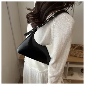 Minimalist black glossy underarm shoulder bag for women with adjustable metal strap