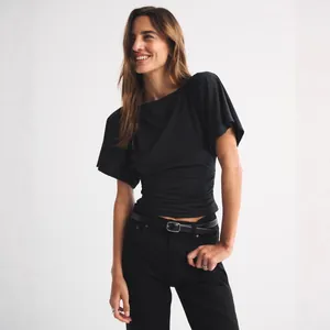 Stylish women's black batwing sleeve t-shirt with ruched waist and casual cropped fit.