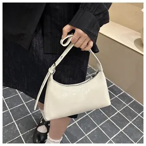 Minimalist white glossy underarm handbag with adjustable buckle strap detail for women