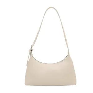 Minimalist cream faux leather underarm baguette bag with adjustable strap for women