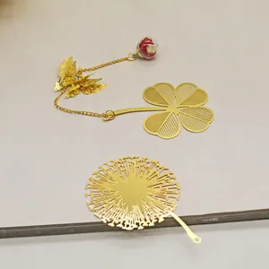 Golden brass hollow metal bookmarks featuring four-leaf clover and dandelion flower designs