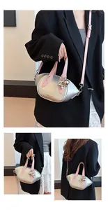 Silver metallic mini handbag with pink straps and balloon dog charm for women