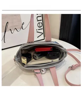 Open view of silver bucket bag showing large interior capacity for cosmetics