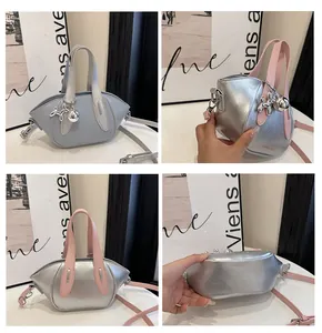 Detailed views of metallic silver bucket bag with balloon dog charm and pink handles