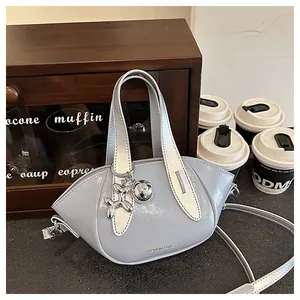 Chic light blue glossy crossbody bag with balloon dog charm for commuting